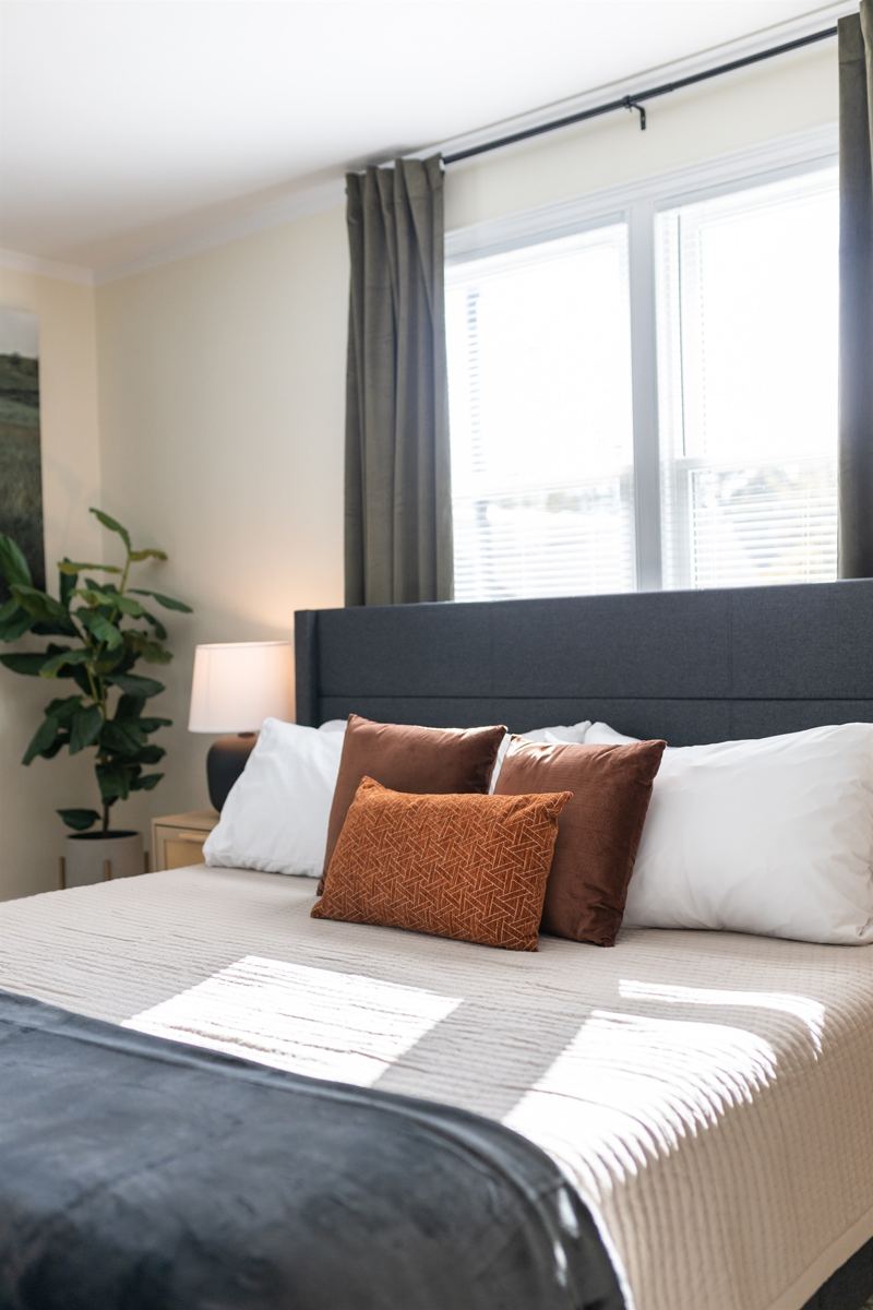 Main House Bottom Floor Unit Bedroom #2 with King Bed, En-Suite Bathroom, 55 inch adjustable ROKU TV, Sound Machine & Blackout Curtains.