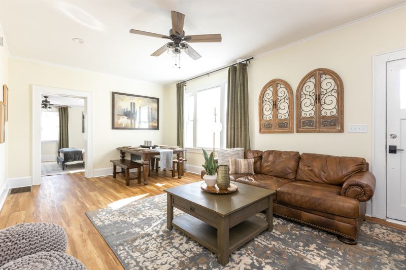Main House Bottom Floor Unit - Open Concept Living Room & Dining Area with 55 Inch ROKU TV.