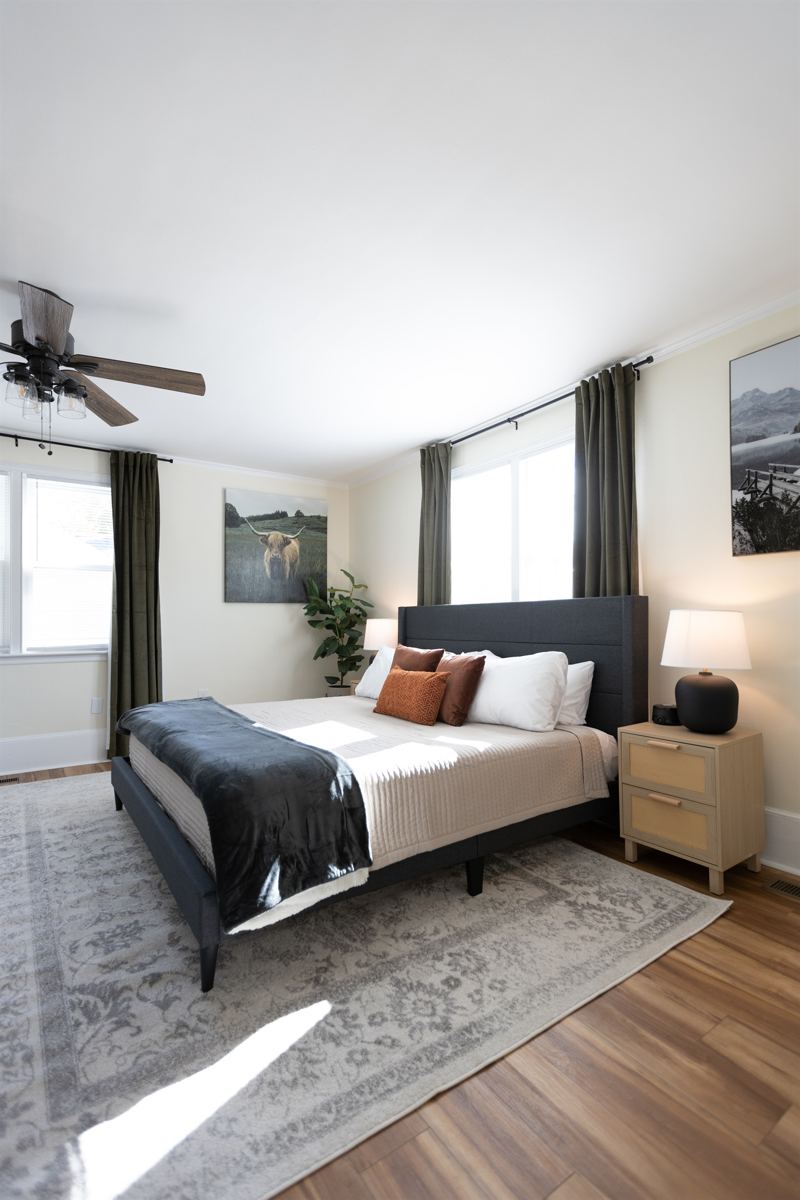Bottom Floor Unit Bedroom #2 with King Bed, En-Suite Bathroom, 55 inch adjustable ROKU TV, Sound Machine & Blackout Curtains.