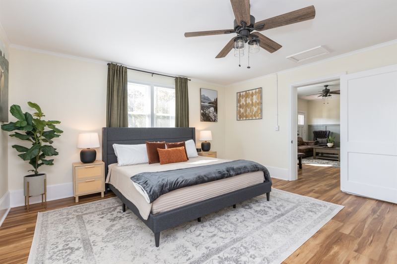 Bottom Floor Unit Bedroom #2 with King Bed, En-Suite Bathroom, 55 inch adjustable ROKU TV, Sound Machine & Blackout Curtains.