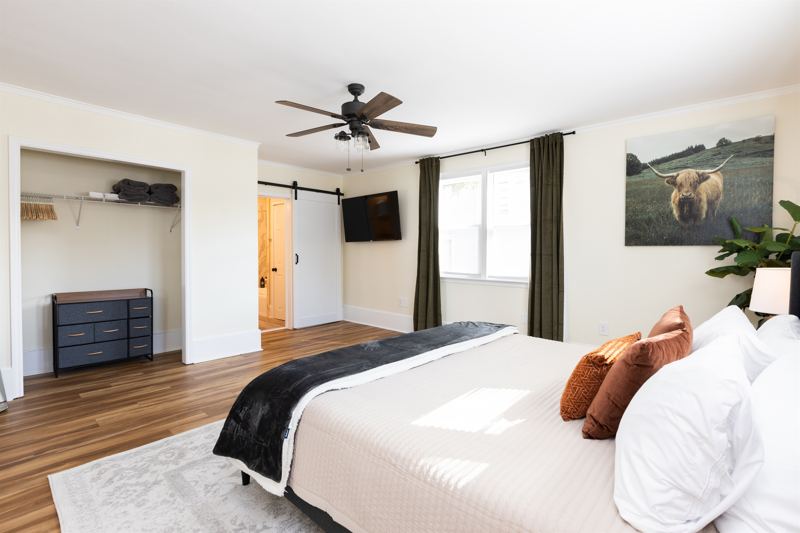 Bottom Floor Unit Bedroom #2 with King Bed, En-Suite Bathroom, 55 inch adjustable ROKU TV, Sound Machine & Blackout Curtains.