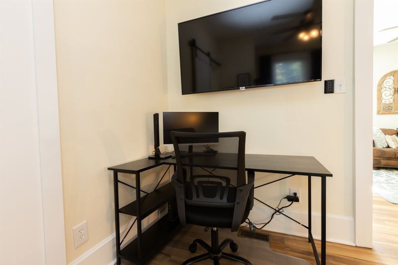 Bottom Unit Bedroom #1 with King Bed, Wn-Suite Bathroom, Work station with desk, lamp and monitor, 55 inch adjustable ROKU TV, Sound Machine & Blackout Curtains.