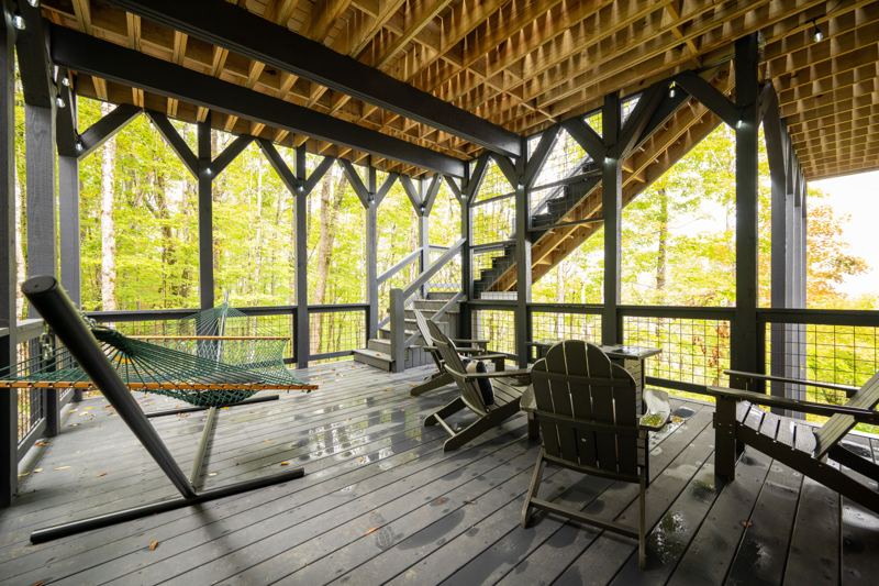 Under deck fun with a hammock, fire table and cozy chairs