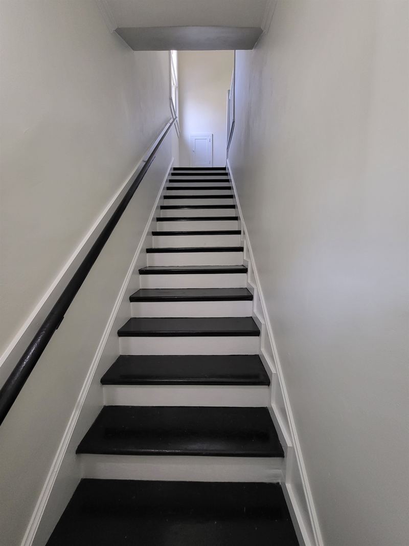 Flight of stairs leading to upstairs unit
