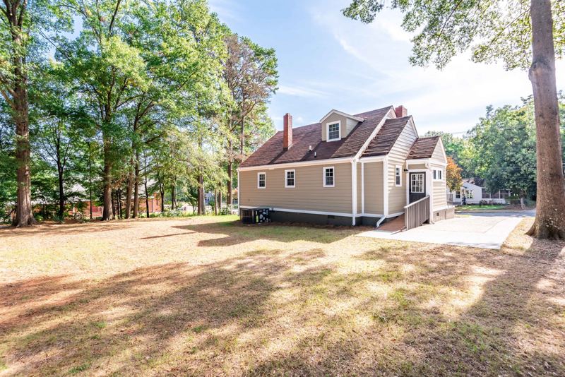 Back of the house with large yard for pets