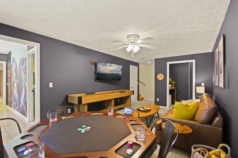 Downstairs game area with poker, shuffleboard and foosball tables, lots of board games for all ages,