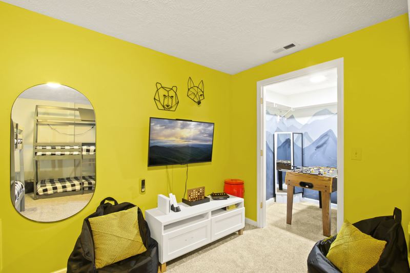 Lower-Level Bedroom with Two (2) Full Bunkbeds, two (2) Twin Bunkbeds, Twin Trundle, 50-inch Smart TV, blackout curtains and white noise machine.