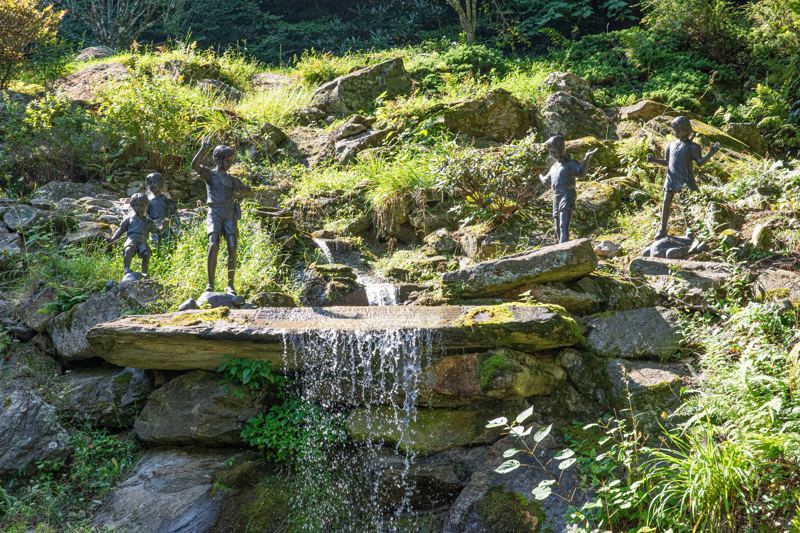85ft waterfall pours into the Koi Fish Pond Below. (Winterized during Winter Season)