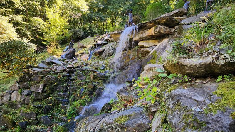 85ft waterfall pours into the Koi Fish Pond Below. (Winterized during Winter Season)