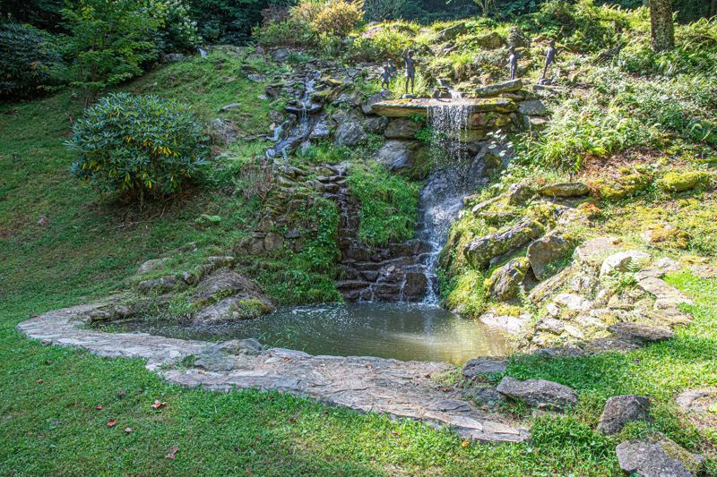 85ft waterfall pours into the Koi Fish Pond Below. (Winterized during Winter Season)