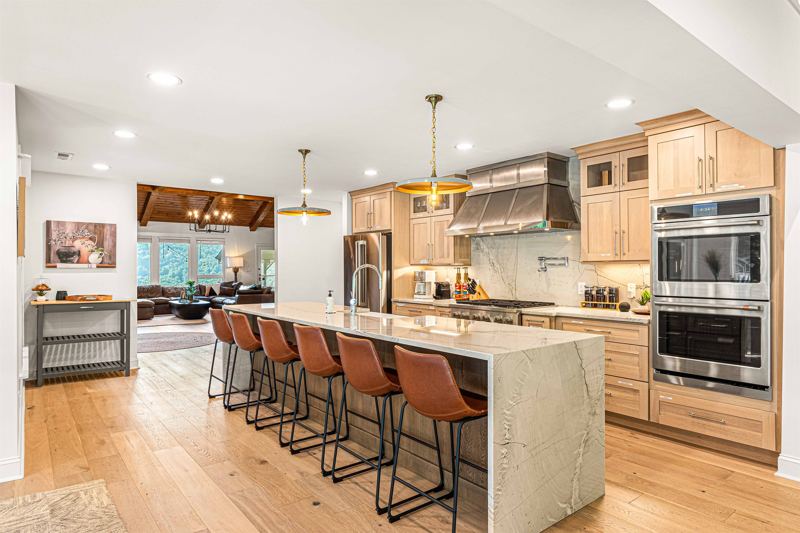 Seating for 8 at the expansive waterfall kitchen island