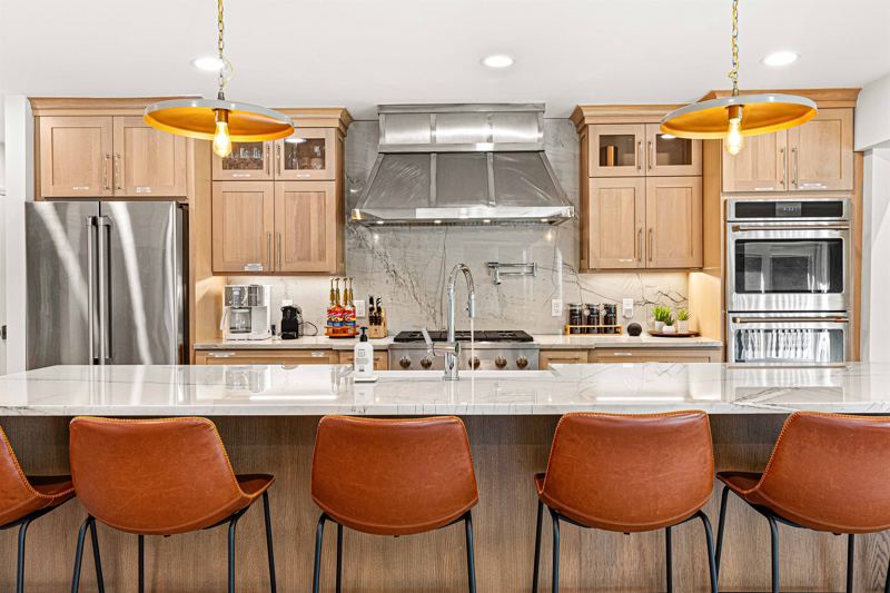Expansive waterfall kitchen island is a chef's dream