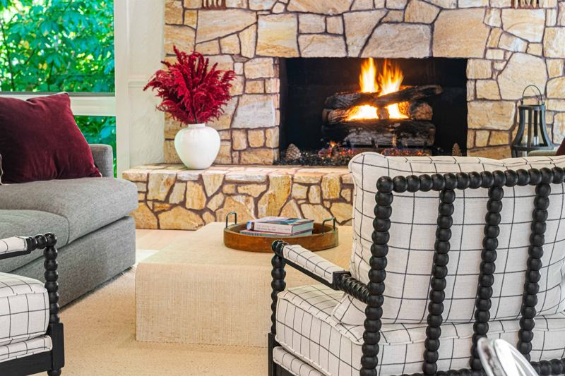 East Great Room with gas fireplace, 65-inch Smart TV, Shuffleboard Table and views of the Waterfall!