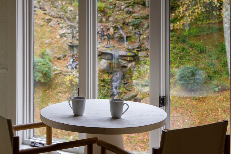 Enjoy your morning coffee overlooking the waterfall