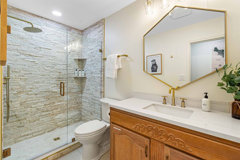 Main Floor Hallway Bathroom with walk-in shower, oversized rainfall shower head and handheld feature