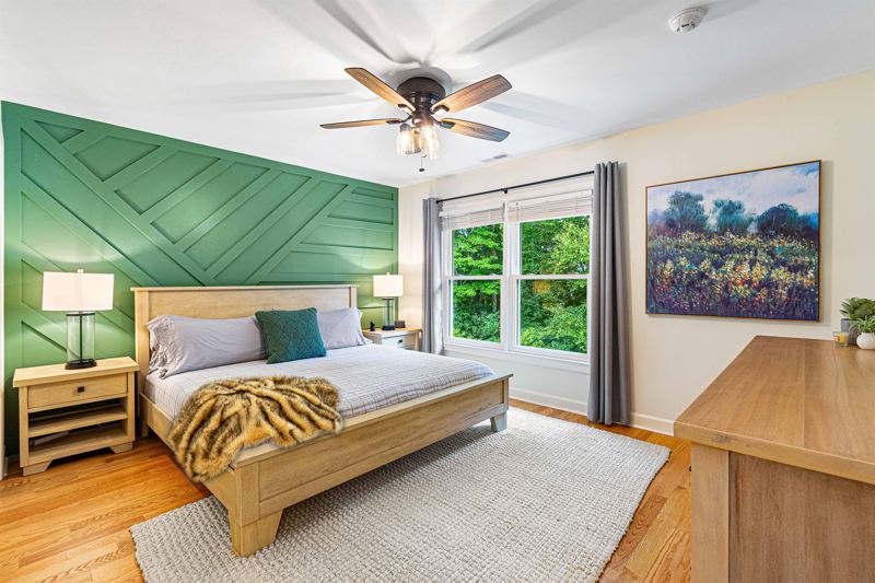 Upper-Level Bedroom #1 with King Bed, Double Closet, 55-inch Smart TV, Blackout Curtains, Sound Machine and Dresser.