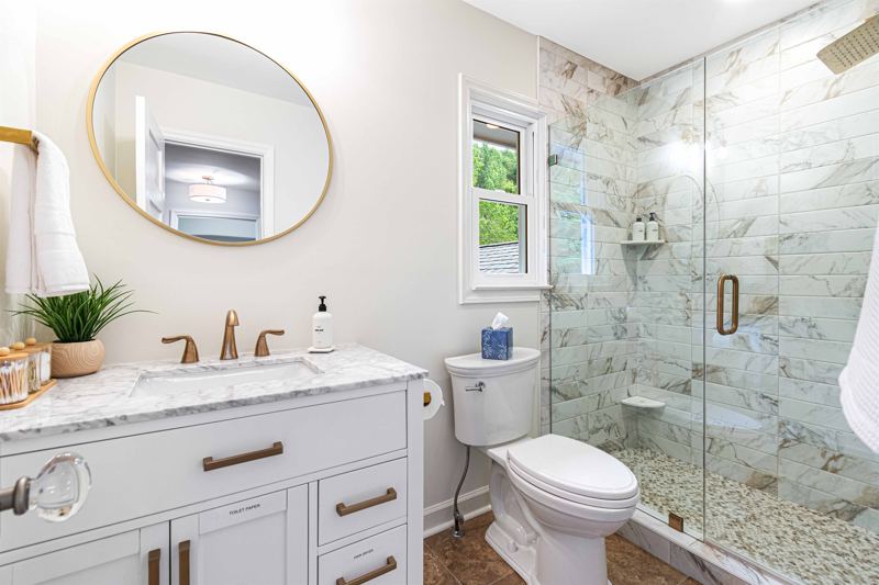 Upper-Level Full Bathroom with Spacious Shower, 12-inch Rainfall showerhead and separate handheld shower.