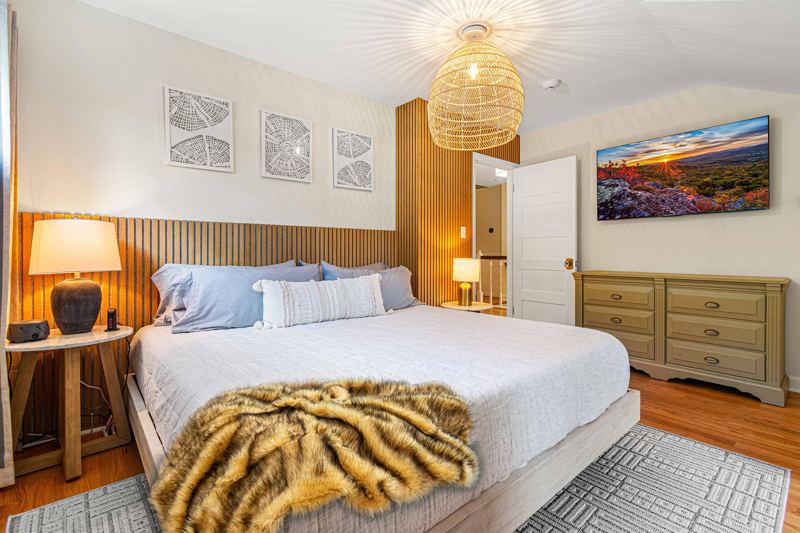 Upper-Level Bedroom #2 with King Bed, Double Closet, 55-inch Smart TV, Blackout Curtains, Sound Machine and Dresser.