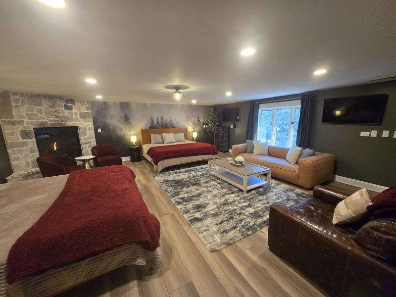 7th Bedrrom with its own fireplace and two king beds