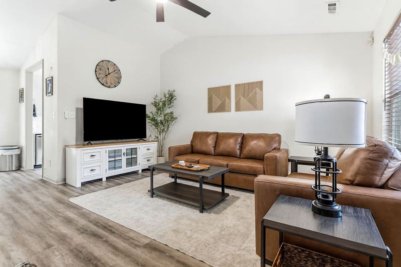 Living Room with 65" Smart TV, dedicated workspace, cards, board games and cozy seating!