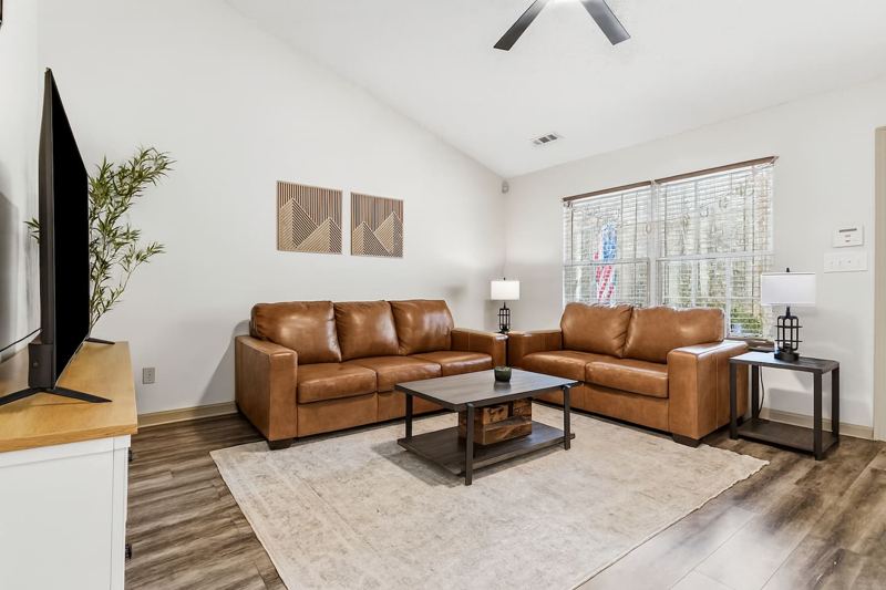 Living Room with 65" Smart TV, dedicated workspace, cards, board games and cozy seating!