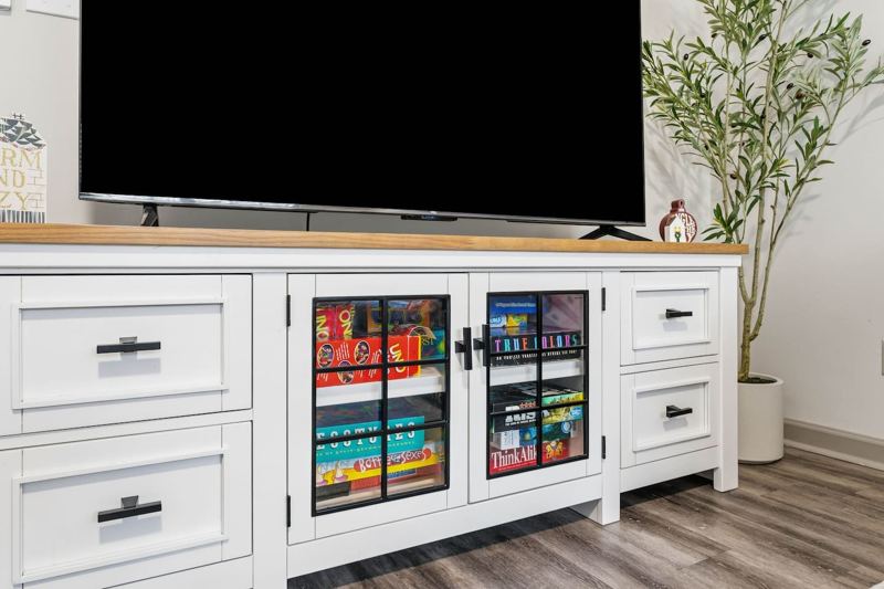 Living Room with 65" Smart TV, dedicated workspace, cards, board games and cozy seating!
