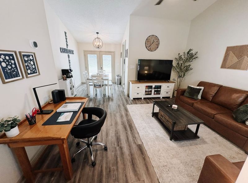 Living Room with 65" Smart TV, dedicated workspace, cards, board games and cozy seating!