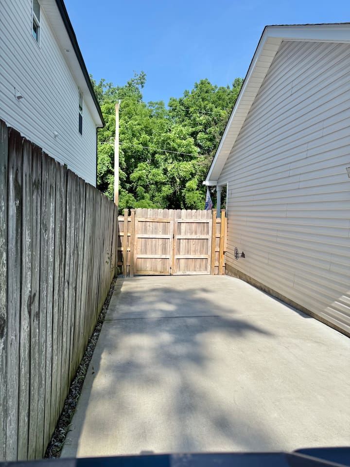 Additional parking for small to medium sized vehicles. This is the view of the gate from the back yard. The other side of the gate is the driveway that holds 2 cars.