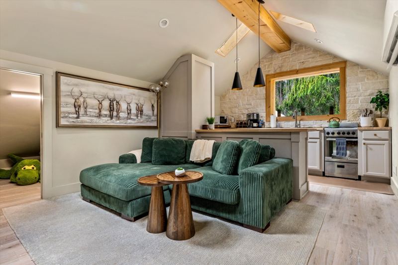 The Penthouse: Cozy Living Room with 55-inch Smart TV, Fireplace, and bistro table.