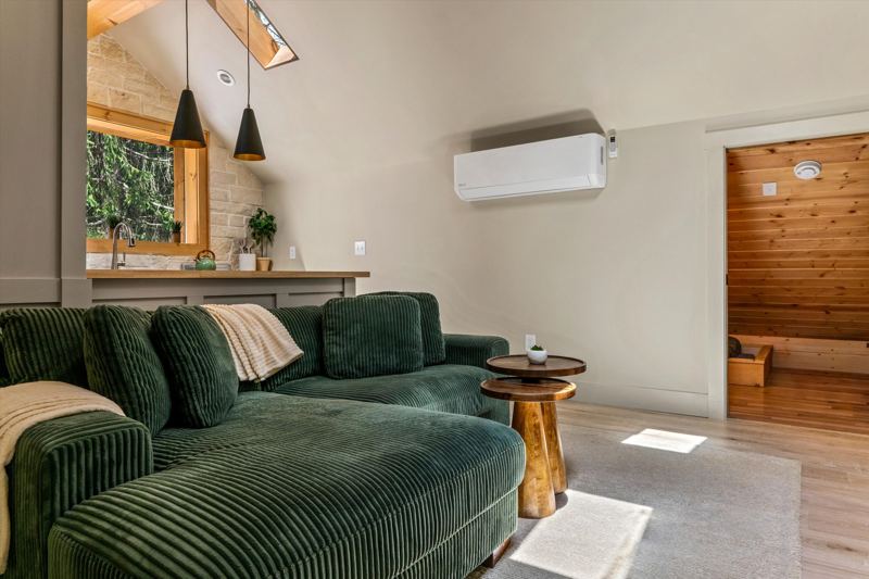 The Penthouse: Cozy Living Room with 55-inch Smart TV, Fireplace, and bistro table.