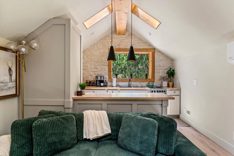 The Penthouse: Cozy Living Room with 55-inch Smart TV, Fireplace, and bistro table.