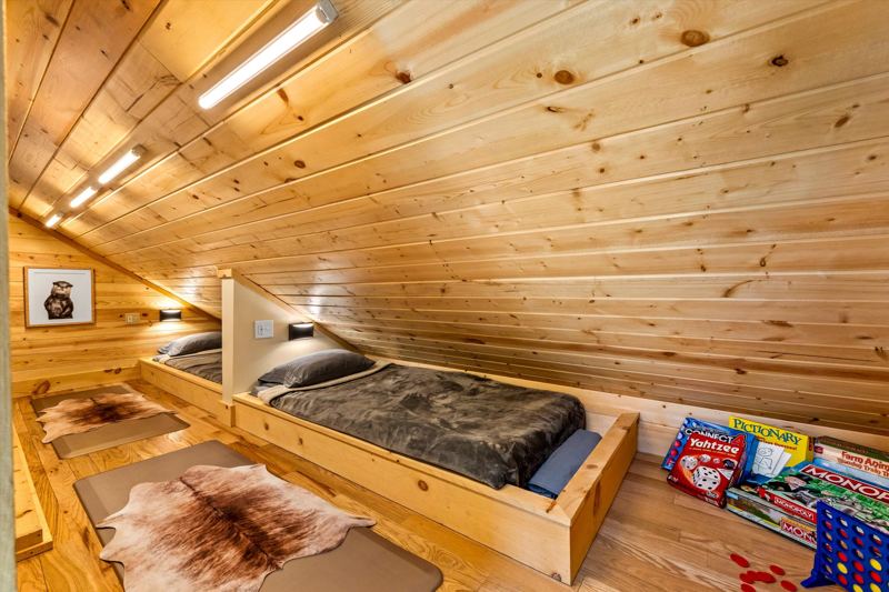 The Penthouse: Two Custom built-in twin beds with individual reading lights, white noise machine and cozy bedding.