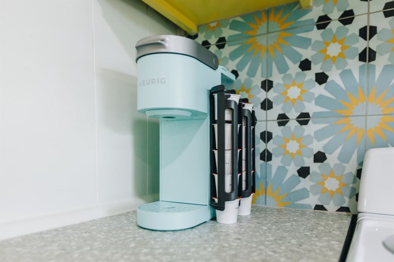 K-Cup Machine with starter pack of pods provided along with creamer and sugar