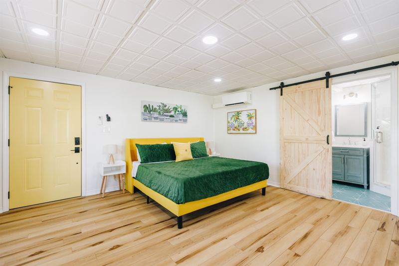 King-Sized Bed with side lamps and sound machine