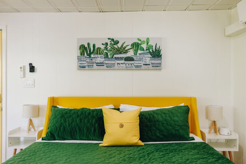 King-Sized Bed with side lamps and sound machine