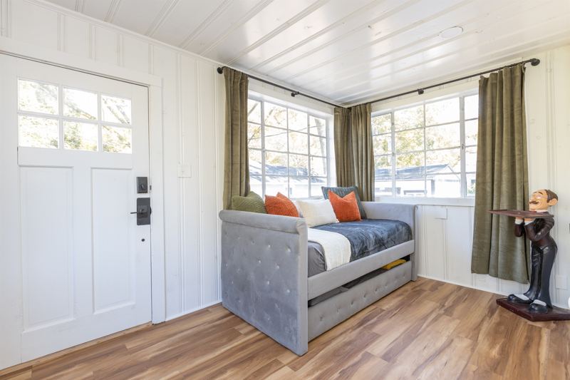 Bottom Floor Sunroom with Trundle Bed with Twin XL Mattress on top and Twin Mattress on the bottom, Blackout Curtains along all windows and sound machine