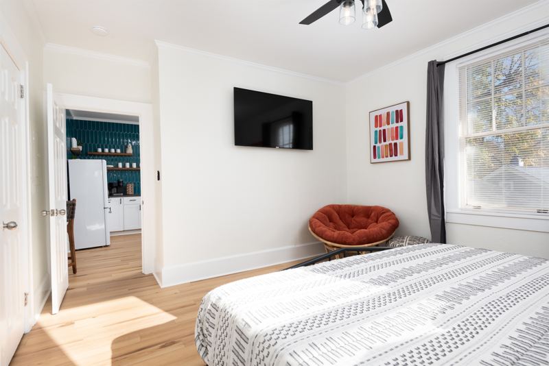 Upstairs Unit Bedroom #1 with King-sized Bed, 55 inch ROKU TV, Sound Machine & Blackout Curtains.