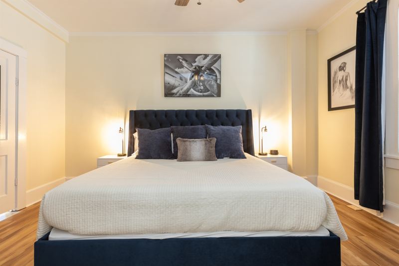 Bottom Unit Bedroom #1 with King Bed, En-Suite Bathroom, Work station with desk, lamp and monitor, 55 inch adjustable ROKU TV, Sound Machine & Blackout Curtains.