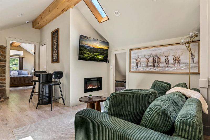 Cozy Living Room with 55-inch Smart TV, Fireplace, and bistro table.