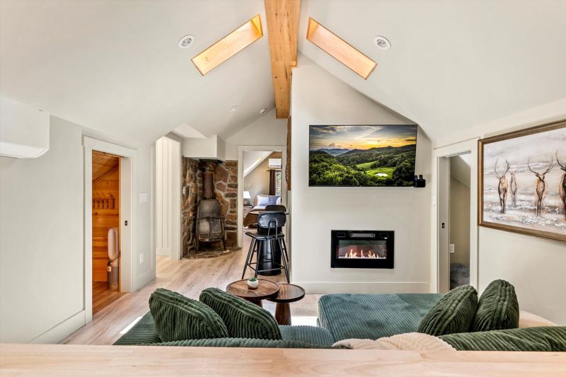 Cozy Living Room with 55-inch Smart TV, Fireplace, and bistro table.
