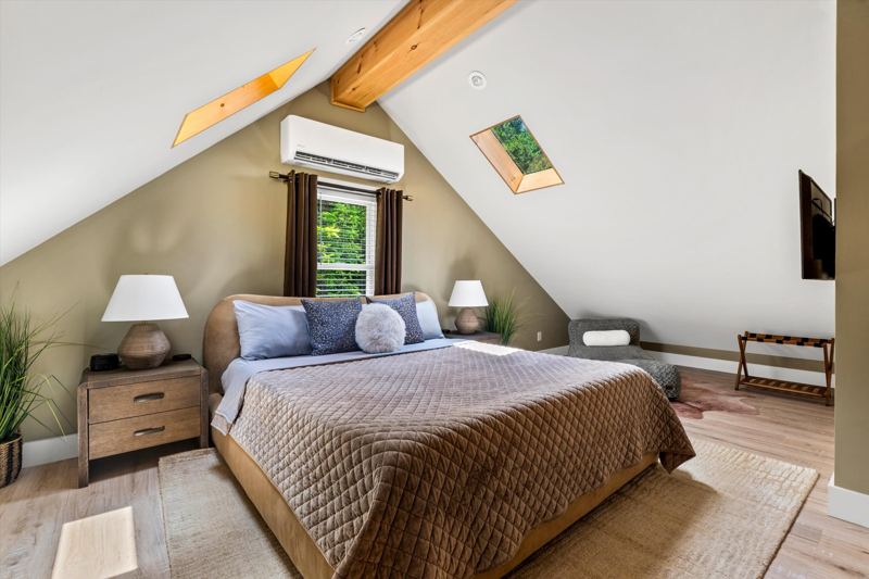 Master Bedroom with King Bed, 42-inch Smart TV, Fireplace, sound machine, blackout curtains and cozy reading chair