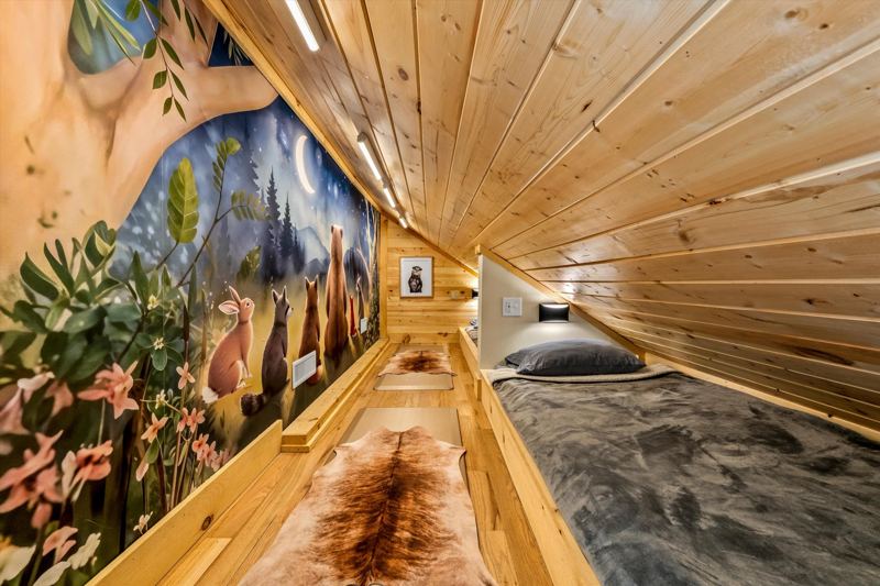 Custom built-in twin beds with individual reading lights, white noise machine and cozy bedding.