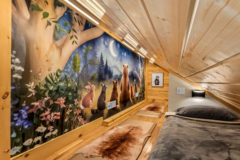 Custom built-in twin beds with individual reading lights, white noise machine and cozy bedding.