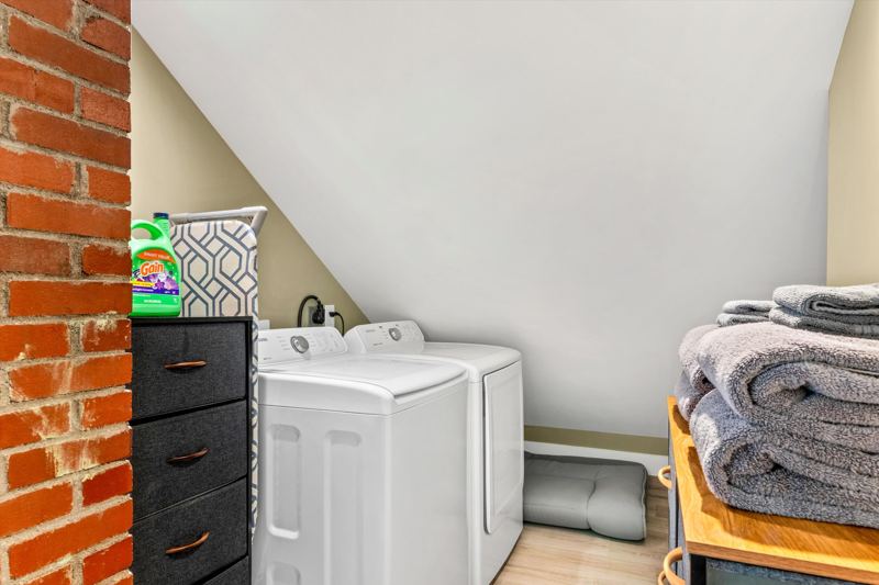 Full size washer & dryer with detergent provided.