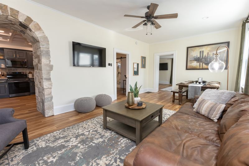 Main House Bottom Floor Unit - Open Concept Living & Dining Area with 55-inch ROKU TV.