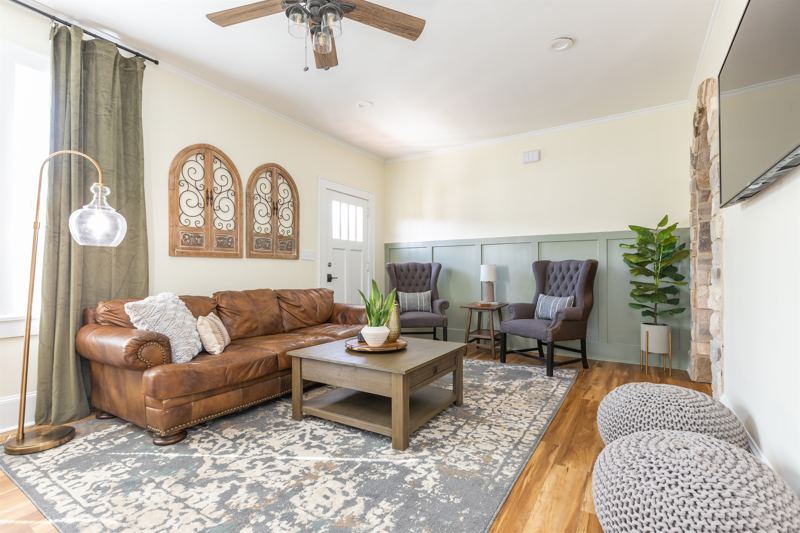 Main House Bottom Floor Unit - Open Concept Living & Dining Area with 55-inch ROKU TV.