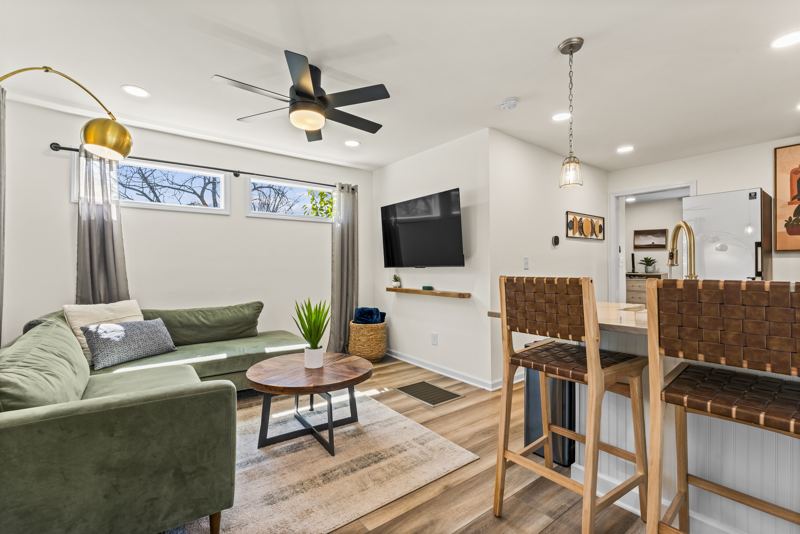 Back Unit 1 bed/1 bath Cozy L-shaped sofa with 58-inch ROKU TV.
